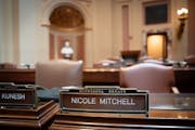 DFL state Sen. Nicole Mitchell was absent from the State Capitol on Wednesday after being charged with first-degree burglary a day earlier.