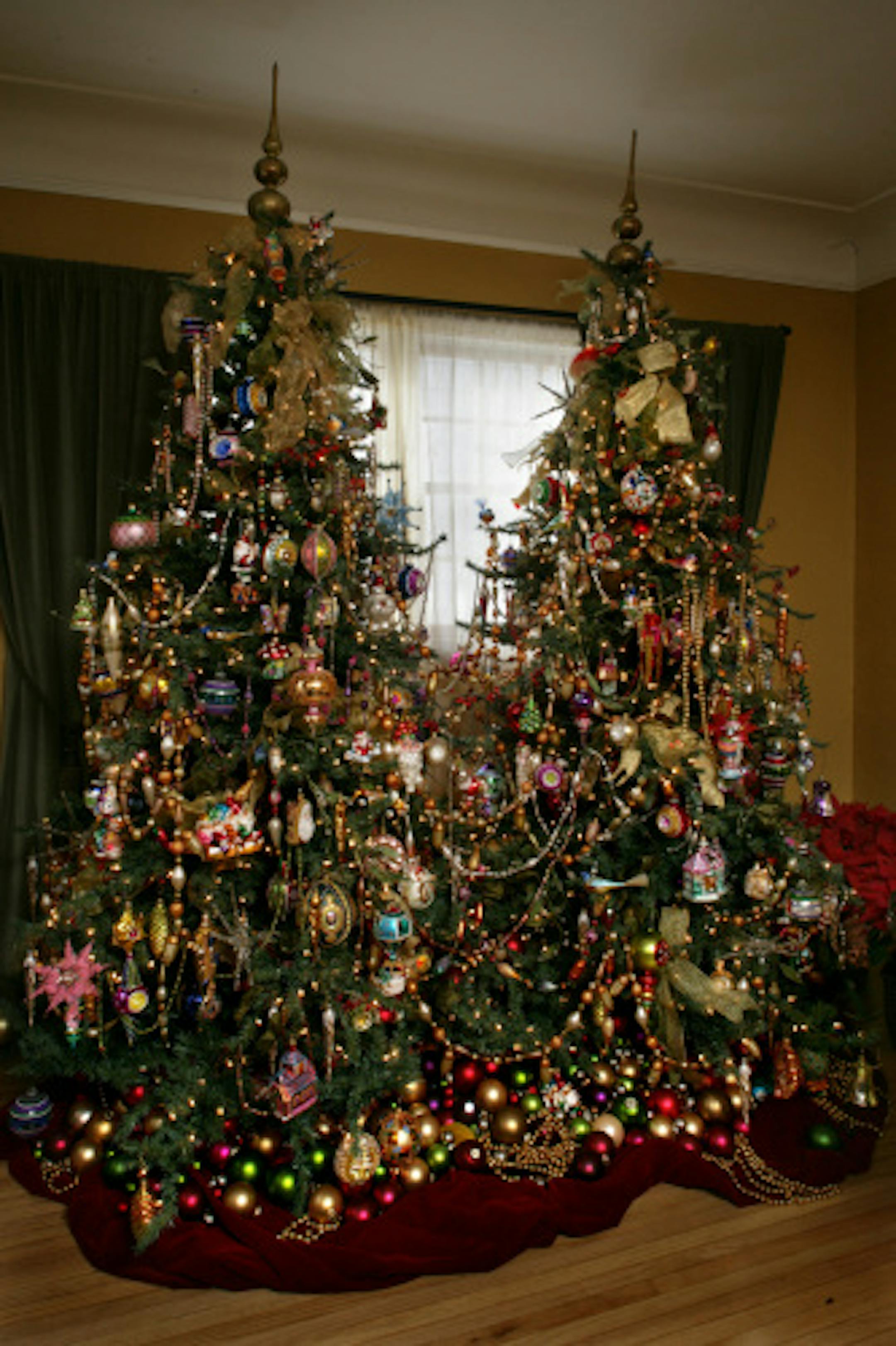 For several years, Larry Pfarr has set up two trees in his modest living room.
