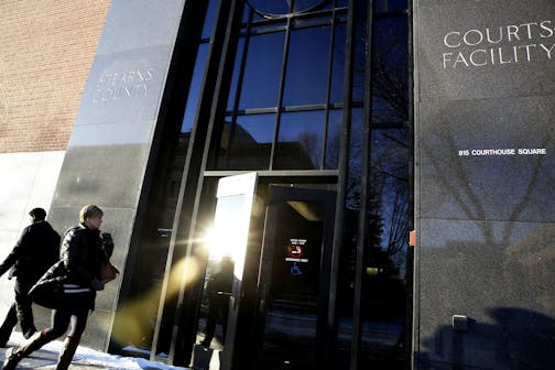 People enter Stearns County Courthouse on the first day of jury selection for the trial of Brian G. Fitch in St. Cloud, Minn. on Monday, January 12, 2015.