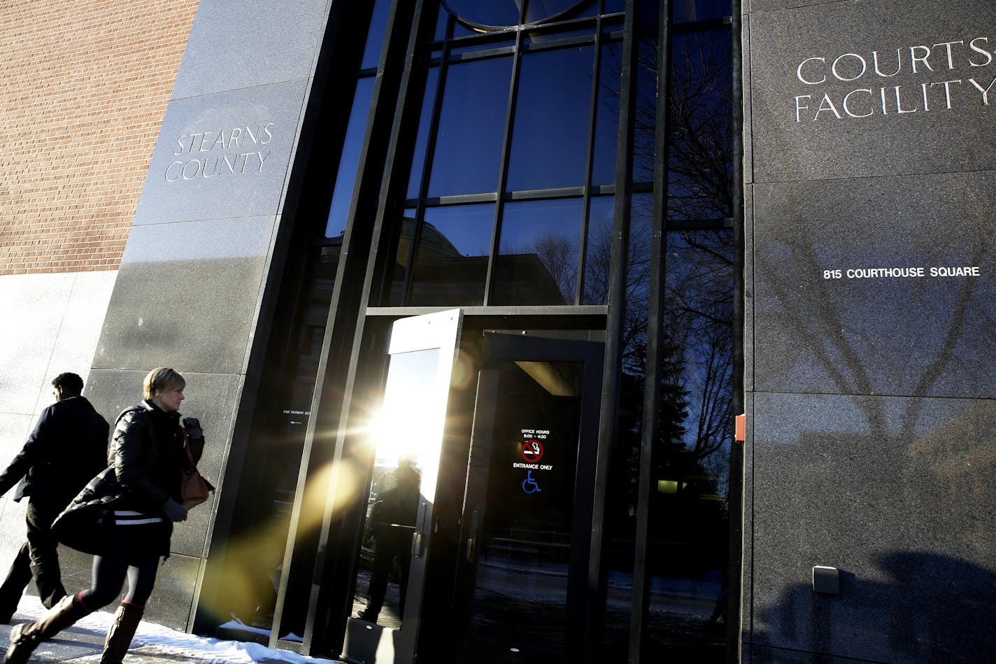 People enter Stearns County Courthouse on the first day of jury selection for the trial of Brian G. Fitch in St. Cloud, Minn. on Monday, January 12, 2015.