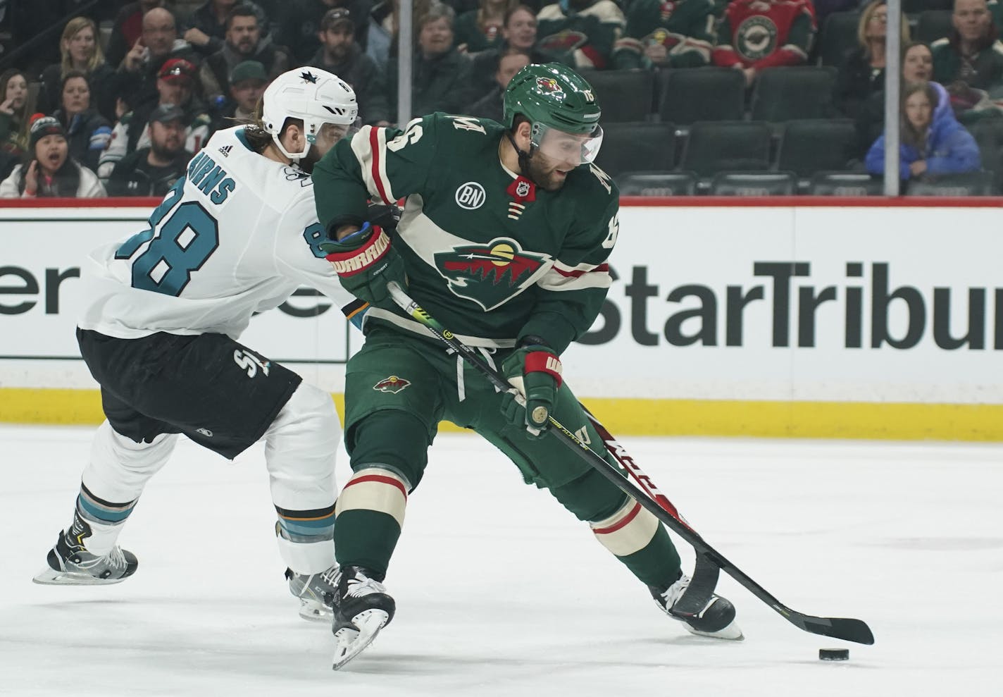 With San Jose Sharks defenseman Brent Burns (88) checking him from behind, Minnesota Wild left wing Jason Zucker (16) lined up a first period shot. ] JEFF WHEELER &#x2022; jeff.wheeler@startribune.com The Minnesota Wild faced the San Jose Sharks in an NHL hockey game Monday night, March 11, 2019 at Xcel Energy Center in St. Paul.