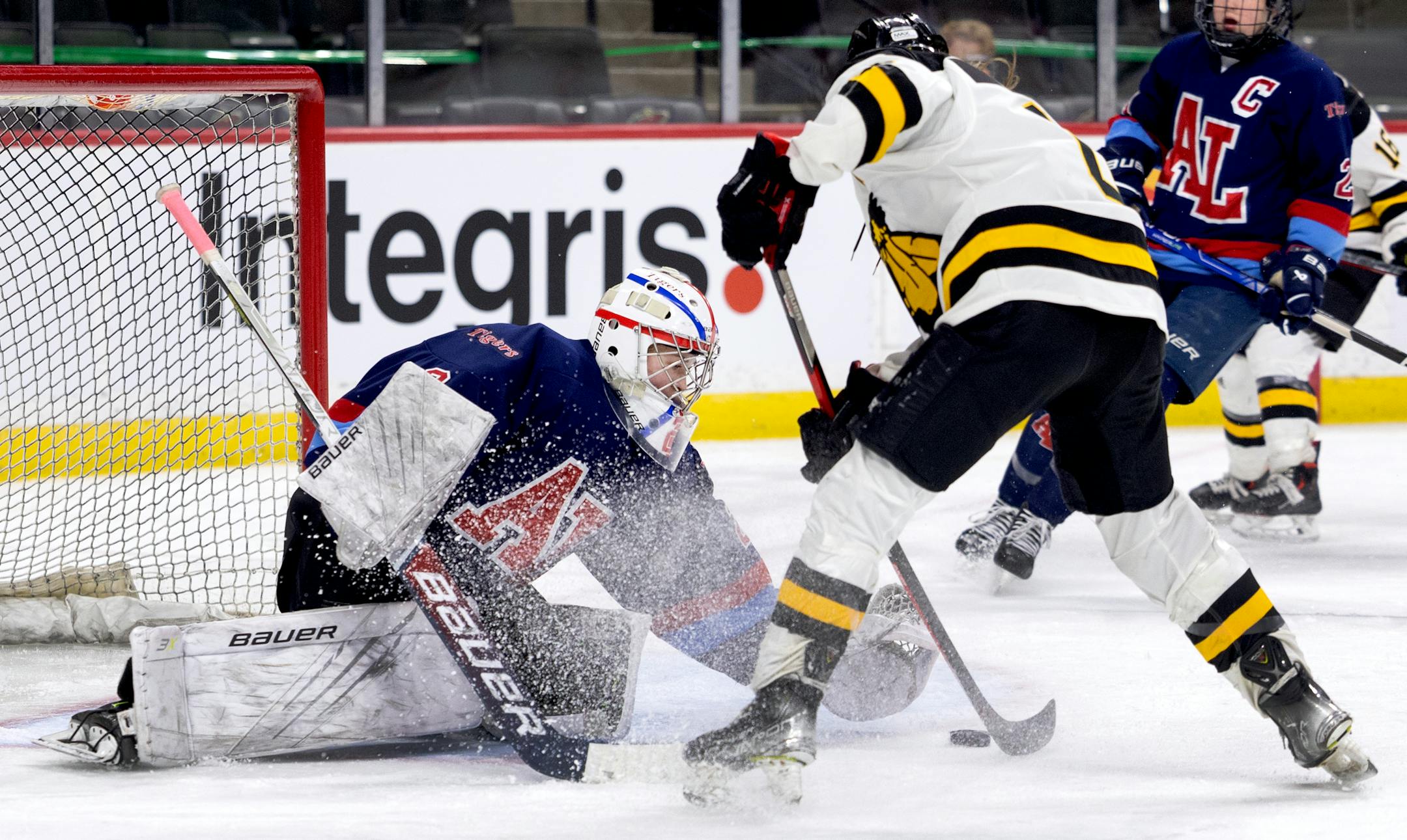 Rylee Bartz (6) of Warroad gets the puck past Albert Lea goalie Jayda Moyer (2) for a goal in the first period.