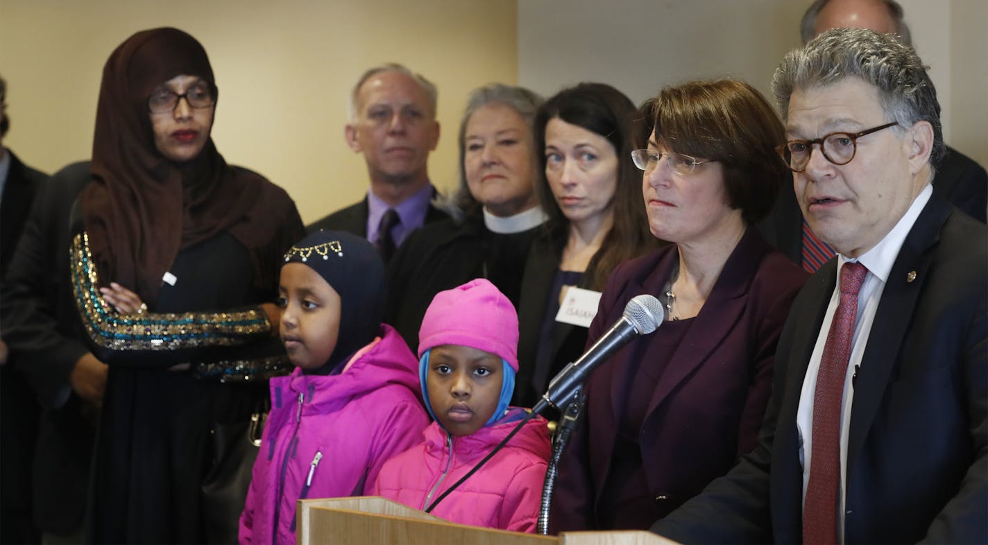 Samira Dahir left ,mother of the two girls left to right Muwahib Abdi 8, and Mumtaz Abdi listened as Minnesota senators Amy Klobuchar and Al Franken gave a press conference after meeting with Minnesotans affected by President Trump&#xed;s immigration orders on refugees Sunday January 29, 2017 in St. Paul, MN.