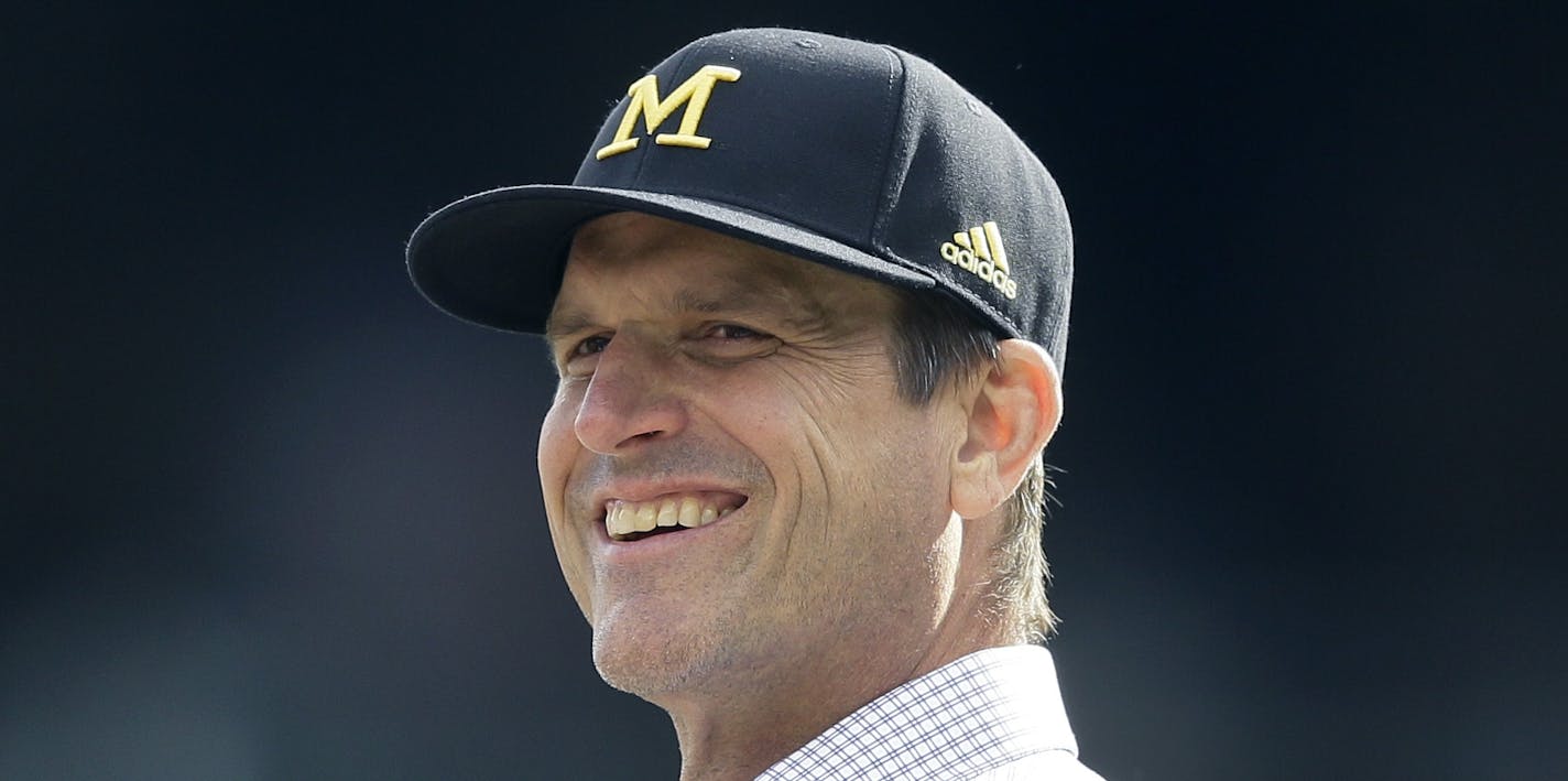 University of Michigan head football coach Jim Harbaugh watches batting practice before a baseball game between the Detroit Tigers and the Oakland Athletics, Wednesday, April 27, 2016, in Detroit. (AP Photo/Carlos Osorio) ORG XMIT: otkco102