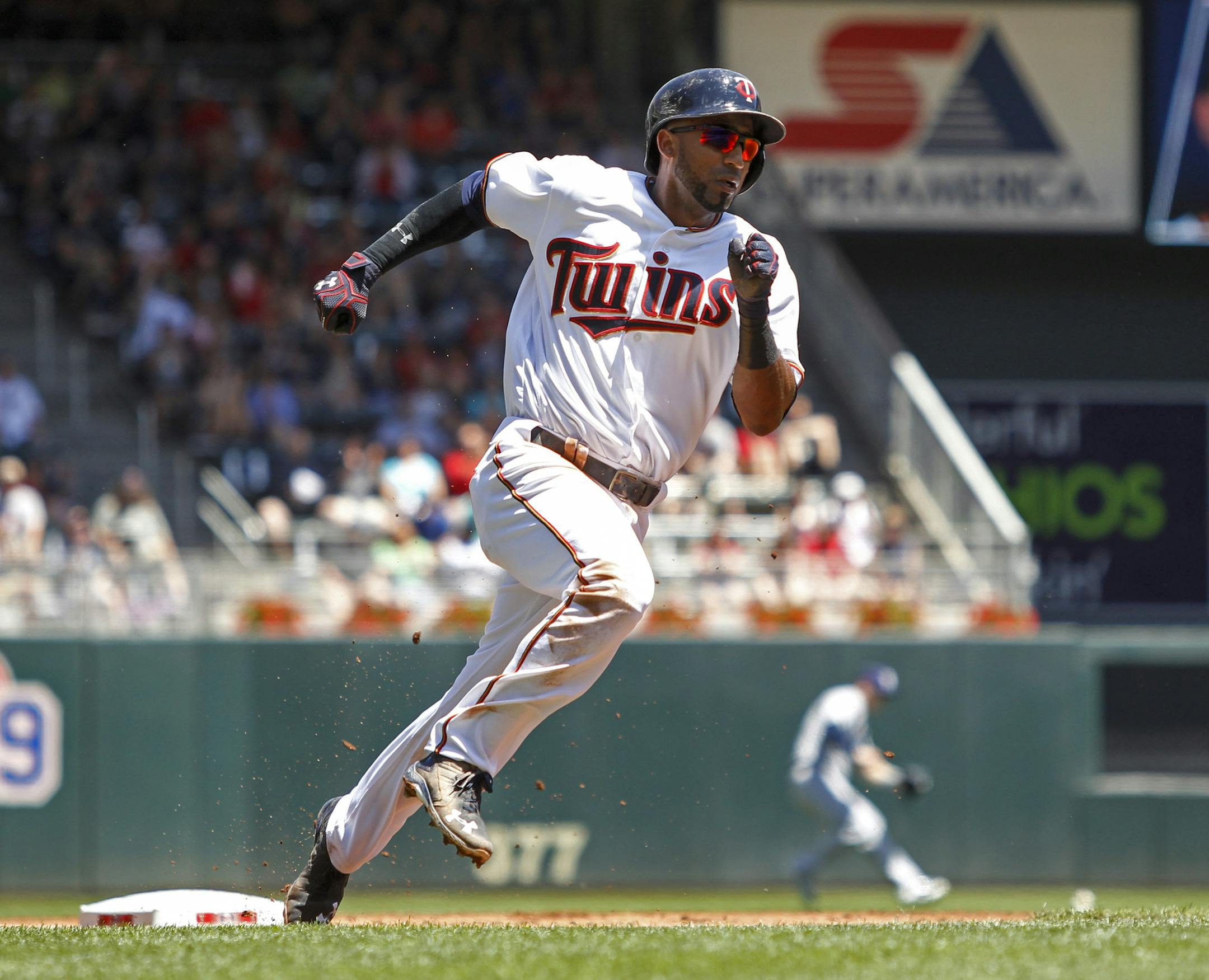 Minnesota Twins' Eduardo Nunez runs on his way to scoring from second base on a single by Joe Mauer against the Tampa Bay Rays in the first inning of a baseball game Sunday, June 5, 2016, in Minneapolis. (AP Photo/Bruce Kluckhohn)