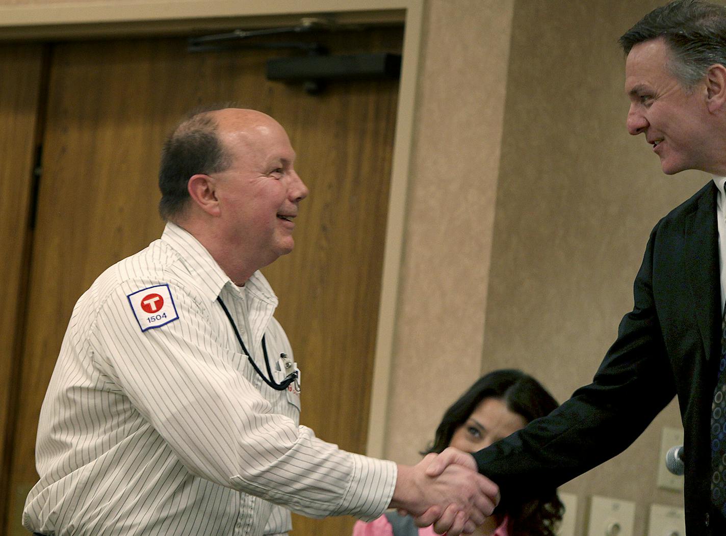 Jerry Olson received a 25-year Elite Operator Award from Metro Transit General Manager Brian Lamb at the annual Metro Transit banquet at the Ramada Plaza Minneapolis, Thursday, June 6, 2013. Olson started at Metro Transit in 1972. (ELIZABETH FLORES/STAR TRIBUNE) ELIZABETH FLORES &#x2022; eflores@startribune.com