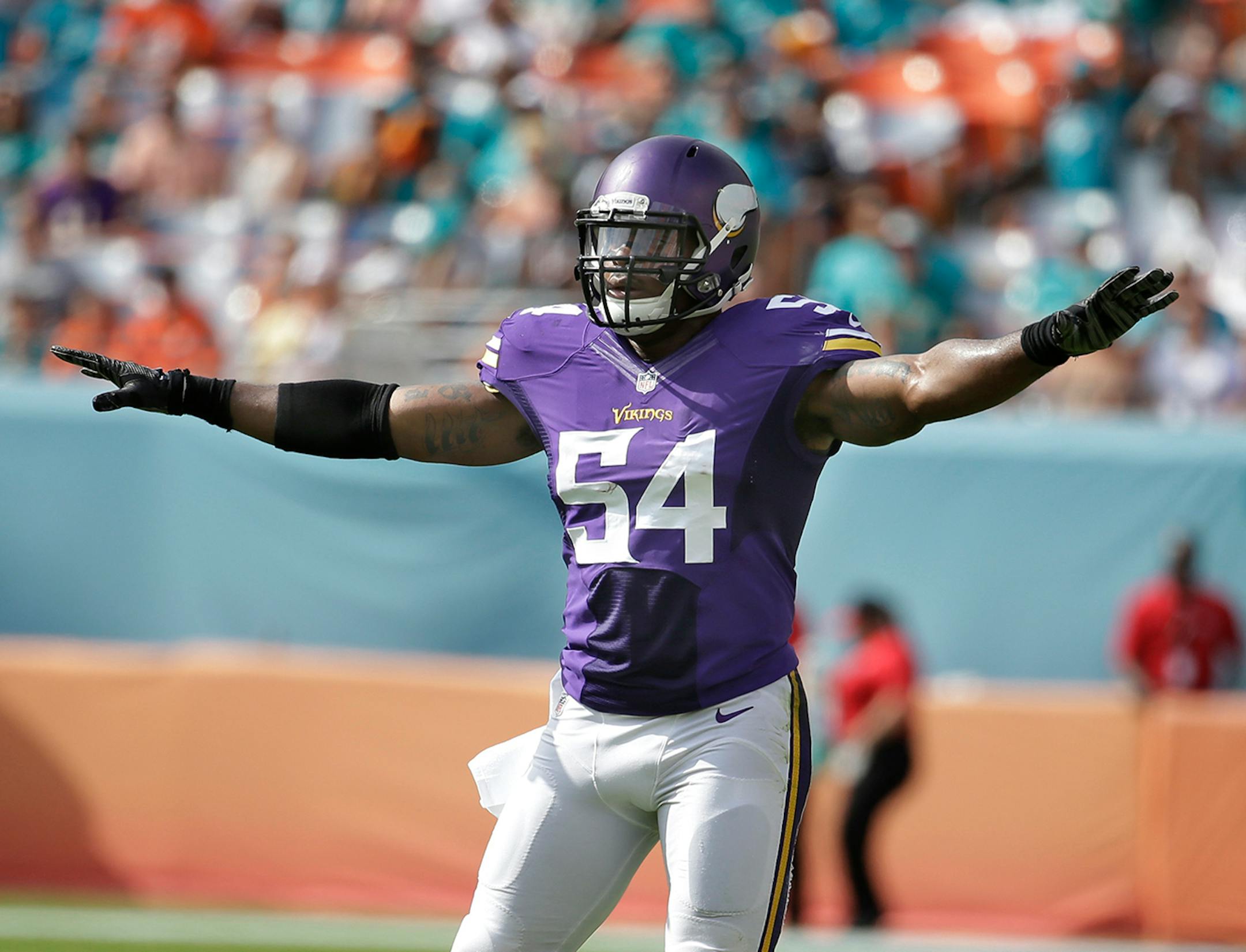Minnesota Vikings middle linebacker Jasper Brinkley (54) gestures as the Miami Dolphins field goal is no good, during the first half of an NFL football game, Sunday, Dec. 21, 2014, in Miami Gardens, Fla. (AP Photo/Lynne Sladky)