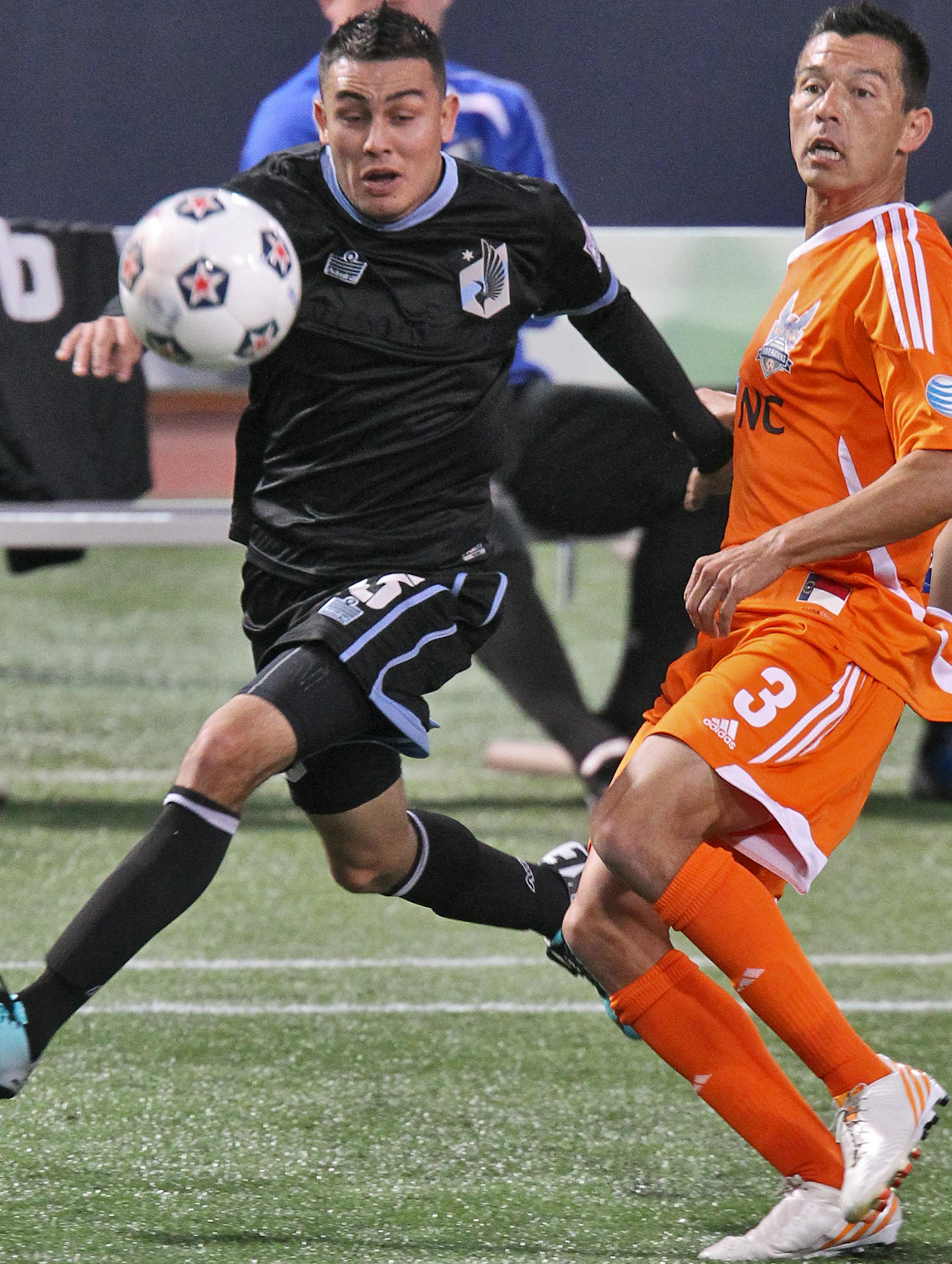 Minnesota United vs. Carolina soccer. United's Miguel Ibarra, left and Carolina's Kupono Low competed. (MARLIN LEVISON/STARTRIBUNE(mlevison@startribune.com (cq all names program)