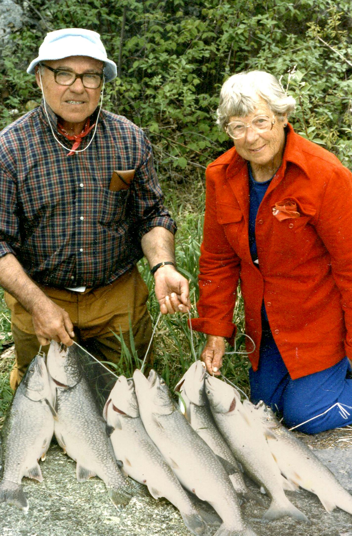 Hugh Becker and his long-time companion Helen Ness with a stringer of fish they caught in 1987.