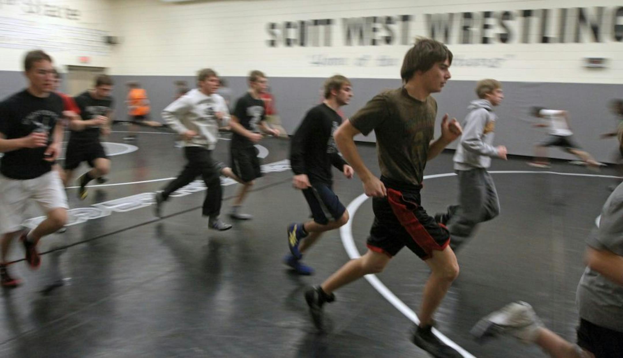The Scott West Wrestling team ran warm-up drills during practice at Jordan High School on 2/8/12. Bruce Bisping/Star Tribune bbisping@startribune.com
