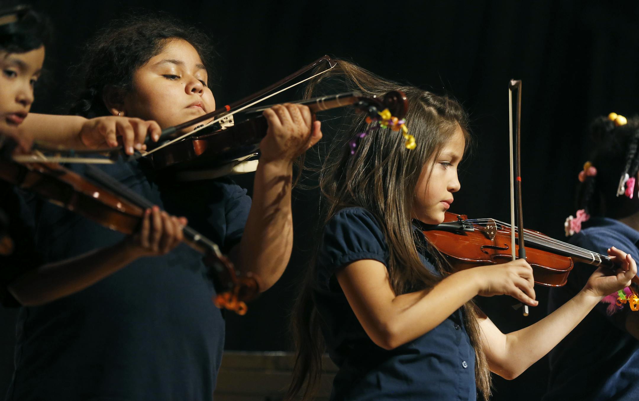 At North H.S., El Sistema students Alicia Ibarra-Martinez, Luna Barban-Sanchez, and Miranda Devora Hernandez performed some tunes including Rhythm Animals and Hot Cross Buns. El Sistema is designed to engage students in classical music as a crime-prevention, social justice program. ]richard.tsong-taatarii/rtsong-taatarii@startribune.com