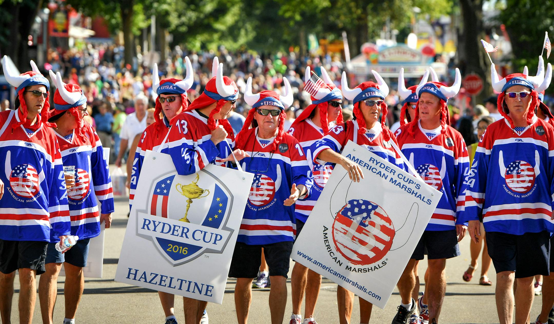 Ryder Cup's American Marshals, a group of local fans who have attended recent Ryder Cups wandered through the State Fair deputizing citizen supporters, posing for selfies and serenading people with a Ryder oriented "You are my Sunshine." ] GLEN STUBBE * gstubbe@startribune.com Thursday, September 1, 2016 Feature story on the American Marshals, (6-12 folks at the fair today) a group of local fans who have attended recent Ryder Cups. They dress up, cheer, and get rowdy. They are gathering at the S