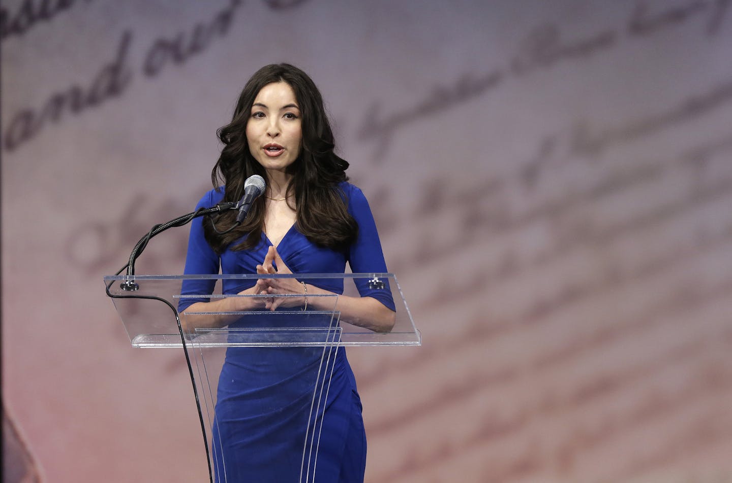 Journalist Roxana Saberi speaks before Former Secretary of State Hillary Rodham Clinton receives the Liberty Medal during a ceremony at the National Constitution Center, Tuesday, Sept. 10, 2013, in Philadelphia. The honor is given annually to an individual who displays courage and conviction while striving to secure liberty for people worldwide. (AP Photo/Matt Rourke) ORG XMIT: OTKMR