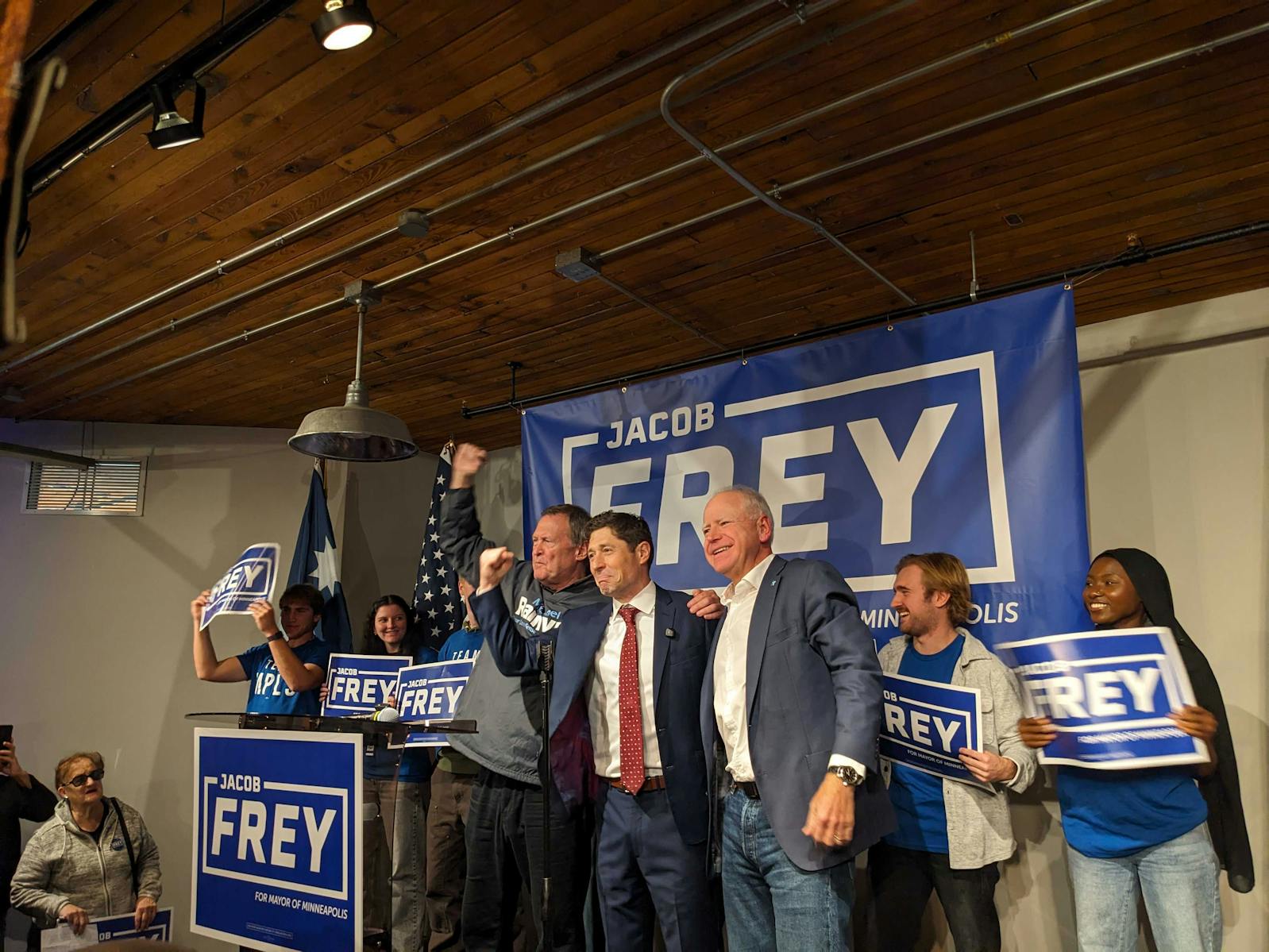 Minneapolis Mayor Jacob Frey, center, stands with Gov. Tim Walz, right, and City Council Member Michael Rainville at a campaign rally Saturday at the Solar Arts Building in northeast Minneapolis.