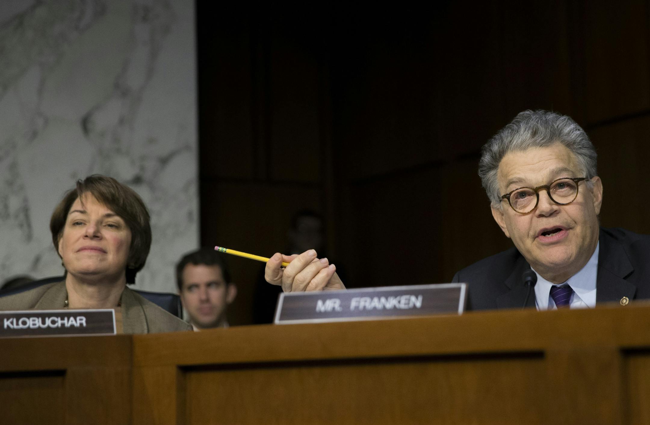 Sen. Amy Klobuchar and Sen. Al Franken at a Senate Judiciary Committee hearing in October.