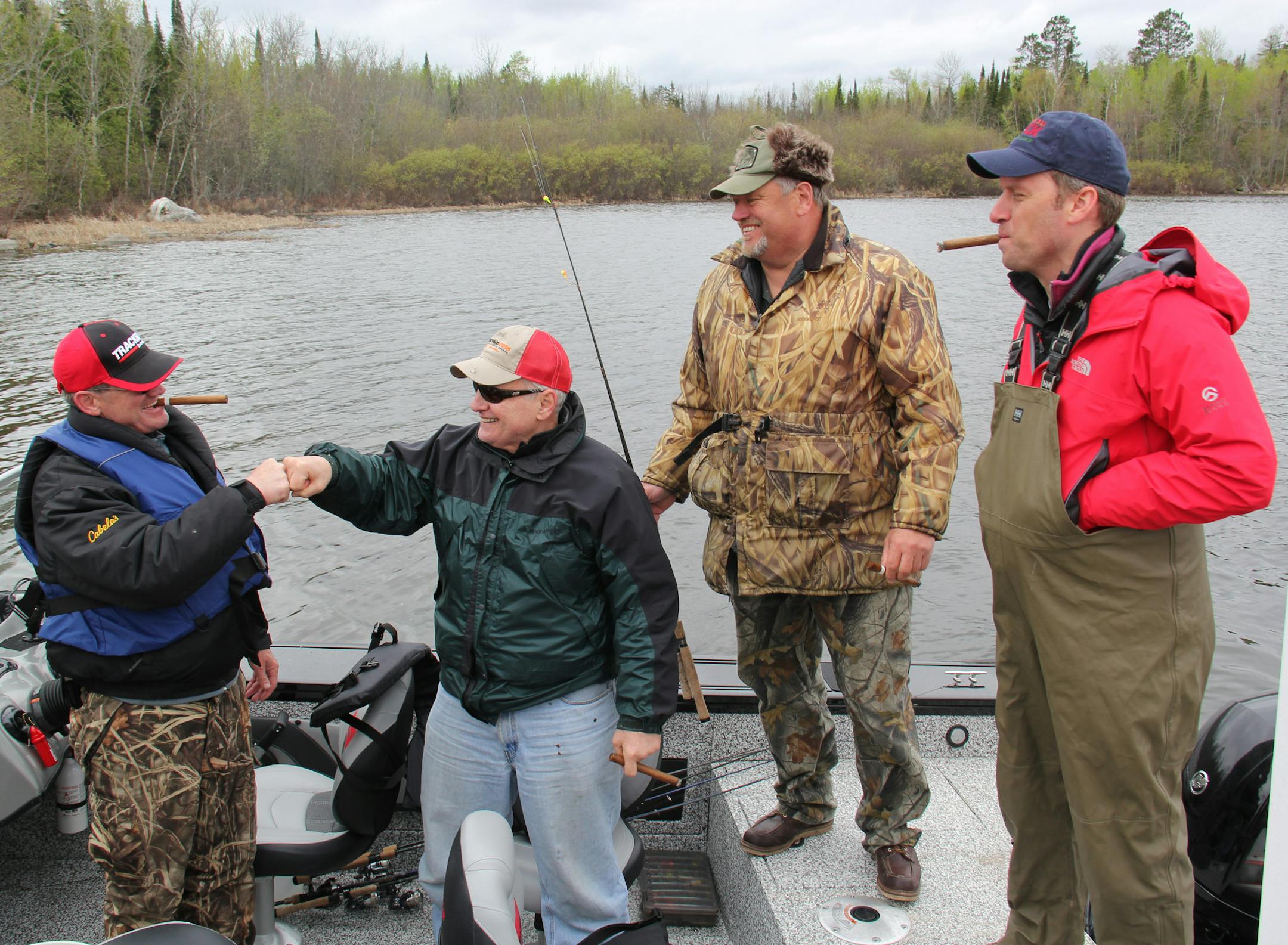 Governor Dayton thanks his fishing guide, Buck Lescarbeau, with a fist bump after a successful fishing expedition. Governor Mark Dayton, Majority Leader Tom Bakk and Speaker Kurt Daudt an fish opener experience fishing Lake Vermilion together Saturday, May 9,2015