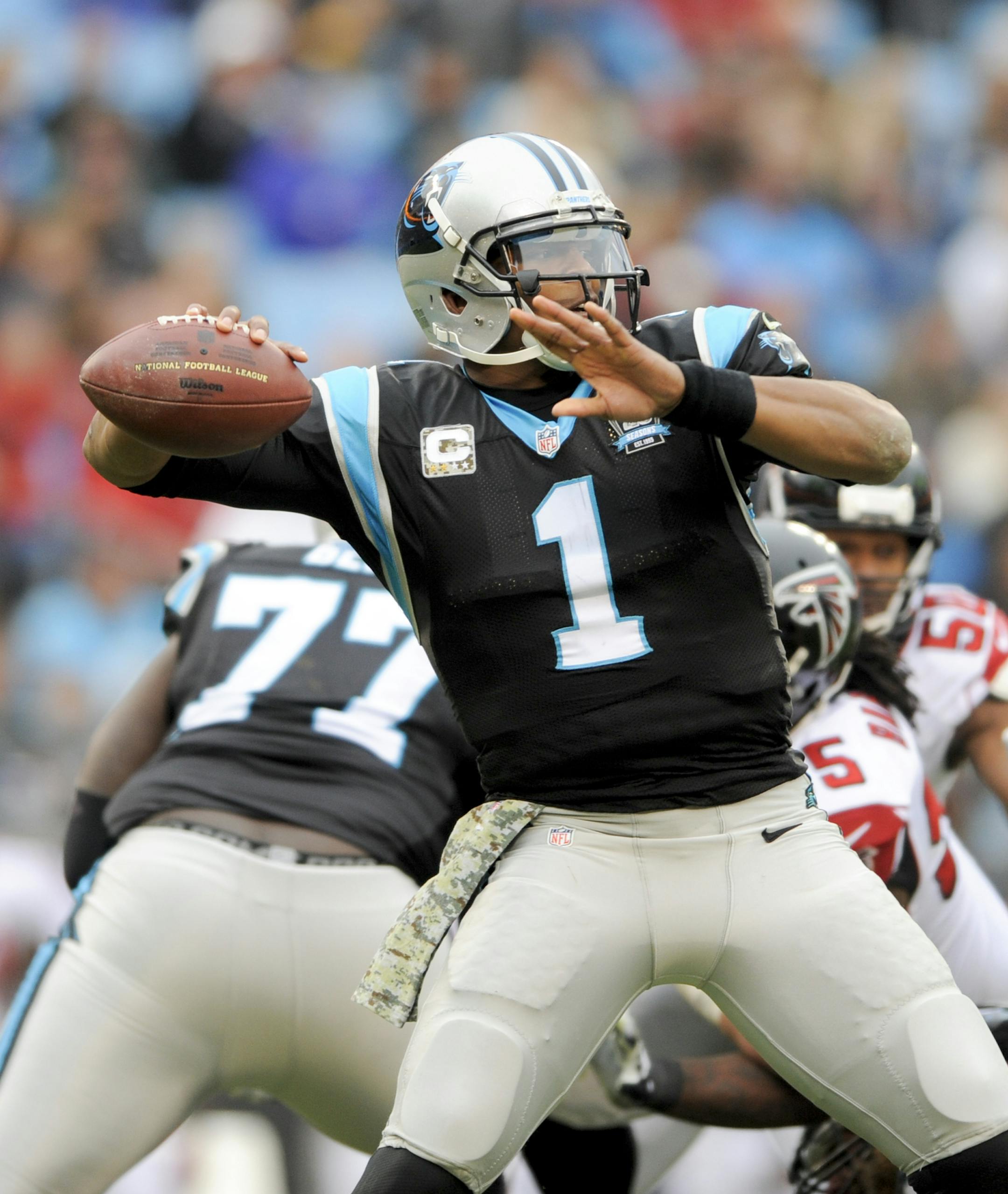 Carolina Panthers quarterback Cam Newton (1) throws a pass during the second half of an NFL football game against the Atlanta Falcons in Charlotte, NC, Sunday, Nov. 16, 2014. (AP Photo/Mike McCarn)