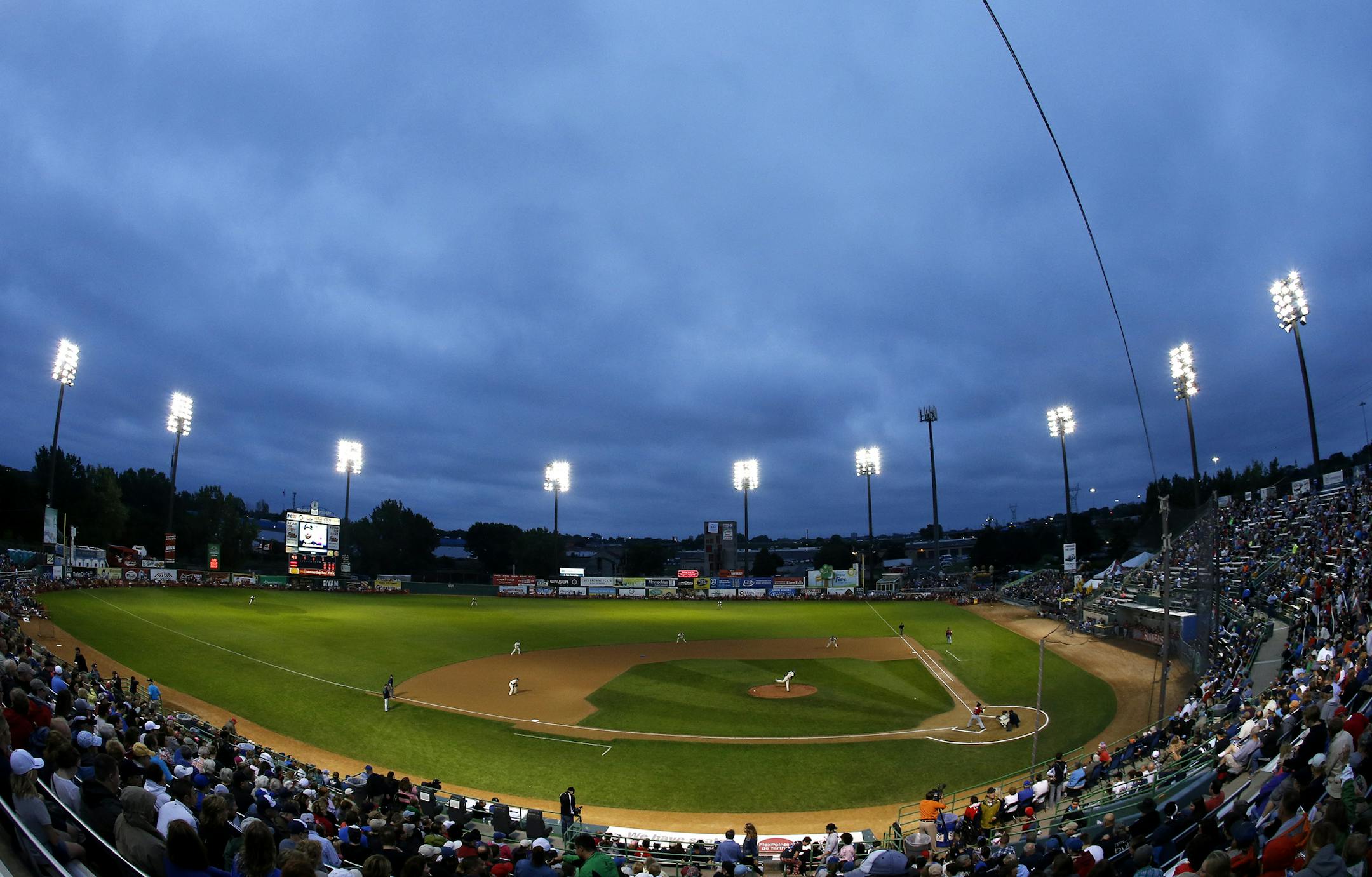 Fans in the stands watched the first inning of the St. Paul Saints final game at Midway Stadium on Thursday night. ] CARLOS GONZALEZ cgonzalez@startribune.com - August 28, 2014, St. Paul, Minn., Midway Stadium, St. Paul Saints baseball vs. Winnipeg - Final Saints game at Midway Stadium