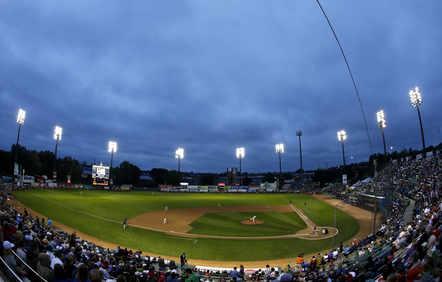 Fans in the stands watched the first inning of the St. Paul Saints final game at Midway Stadium on Thursday night. ] CARLOS GONZALEZ cgonzalez@startribune.com - August 28, 2014, St. Paul, Minn., Midway Stadium, St. Paul Saints baseball vs. Winnipeg - Final Saints game at Midway Stadium