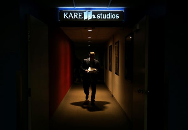 Randy Shaver walks between the studio and the newsroom before the Prep Sports Extra show at KARE 11 in Minneapolis on Friday, Nov. 2, 2018.