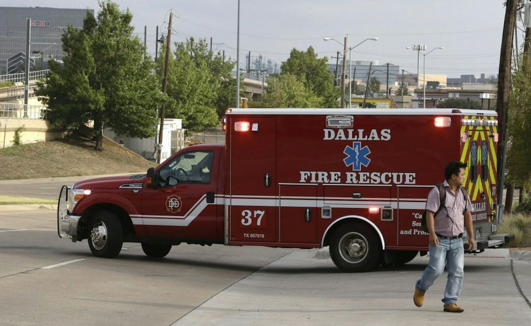 An ambulance pulls out for a run from Dallas Fire-Rescue station 37 in Dallas, Wednesday, Oct. 1, 2014. An EMT ambulance crew from this location are under a 21 day quarantine after a patient they transported tested positive for Ebola.