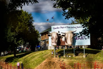 In this 2019 photo, a billboard promoting the Minnesota State Fair stood near the animal barns. 