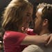 This image released by Lionsgate shows Ryan Gosling, right, and Emma Stone in a scene from, "La La Land." The film was nominated for a Golden Globe aw