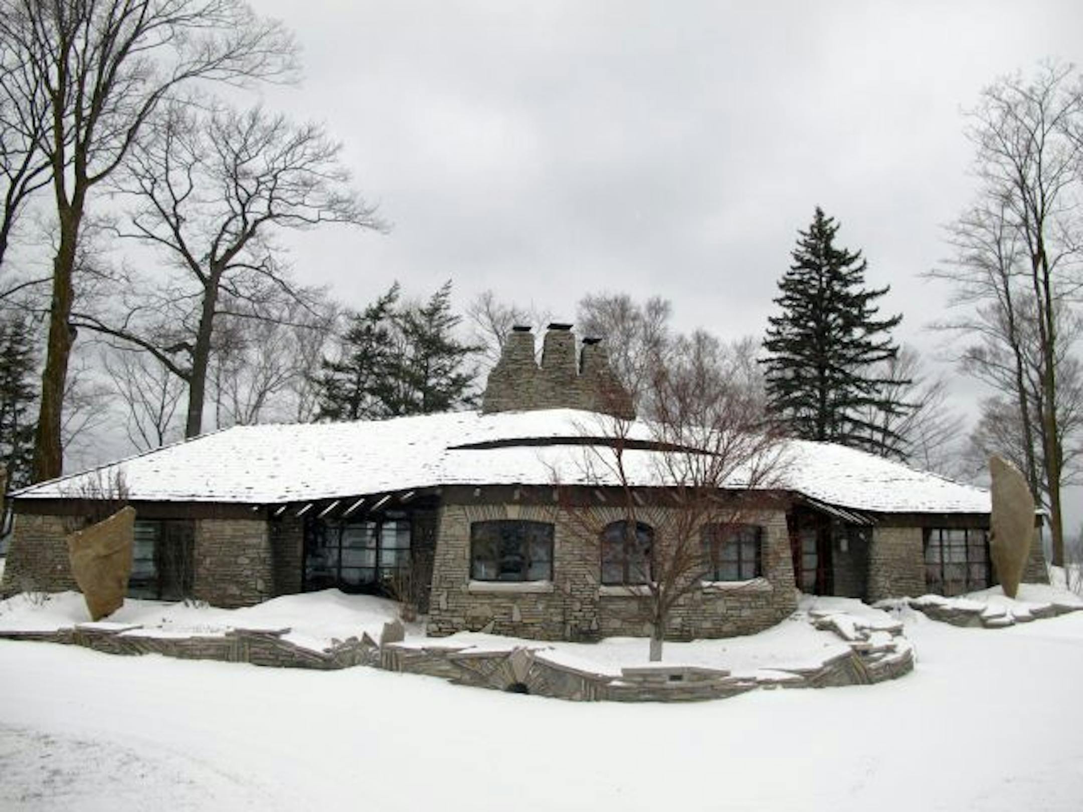 Charlevoix, Michigan, is known for its "mushroom houses," designed by Earl Young, but this lovely house, built in 1948 for gasoline company president William Sucher, is on a larger scale. The house recently was featured in Martha Stewart Living magazine.
