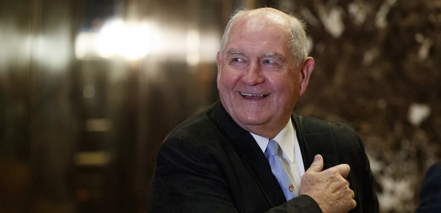 FILE- In this Nov. 30, 2016, file photo, former Georgia Gov. Sonny Perdue smiles as he waits for an elevator in the lobby of Trump Tower in New York. A person familiar with the decision says President-elect Donald Trump has chosen Perdue to serve as agriculture secretary. (AP Photo/Evan Vucci, File) ORG XMIT: MIN2017012514212044