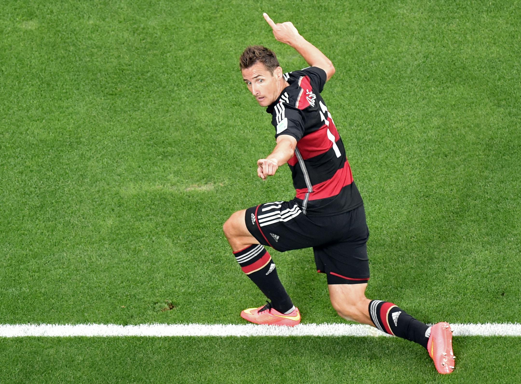 Germany's Miroslav Klose celebrates scoring his side's 2nd goal during the World Cup semifinal soccer match between Brazil and Germany at the Mineirao Stadium in Belo Horizonte, Brazil, Tuesday, July 8, 2014. (AP Photo/Francois Xavier Marit, Pool)