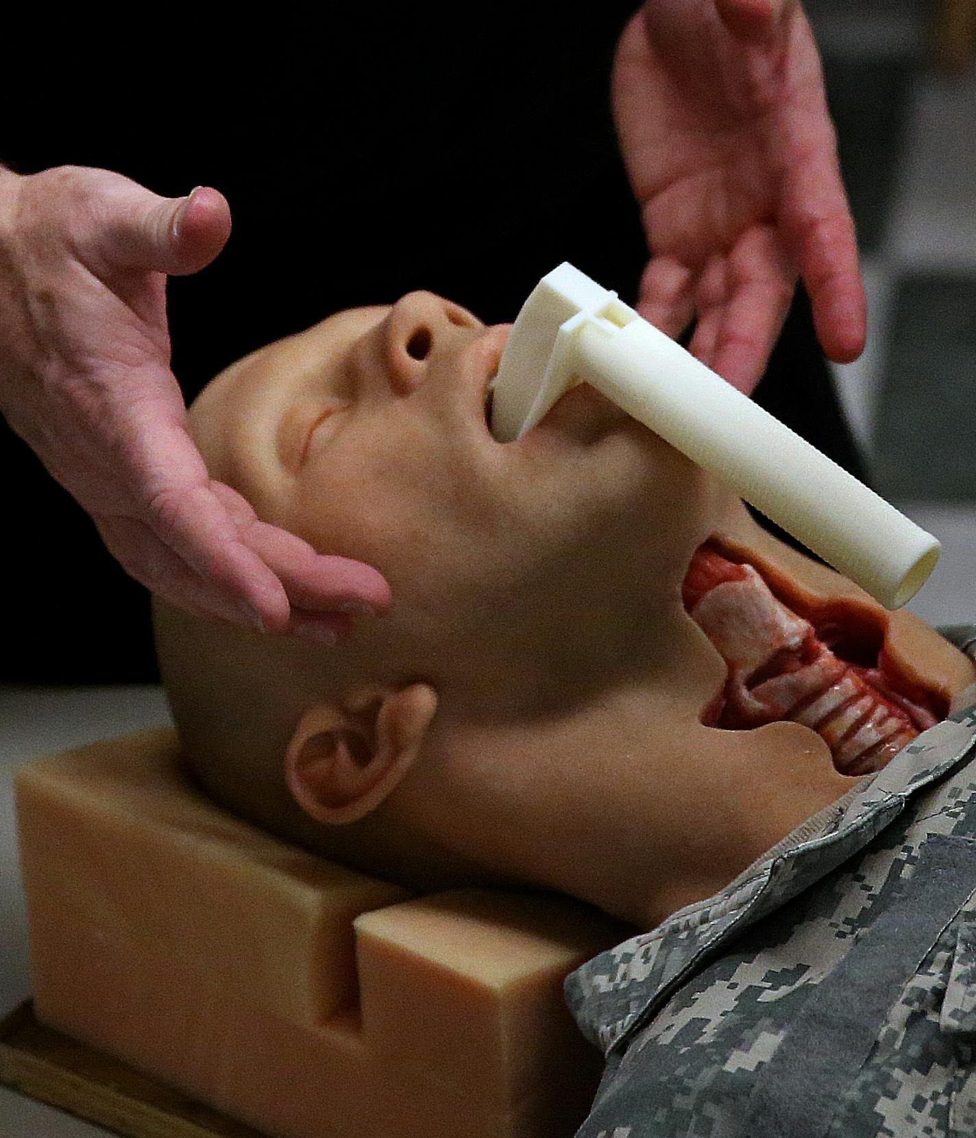 Jack Stubbs, an associate program director with the Center for Research in Education and Simulation Technologies (CREST), demonstrated how the training mannequin is used. ] JIM GEHRZ &#xef; jgehrz@startribune.com / Minneapolis, MN / January 21, 2014 / 12:00 PM BACKGROUND INFORMATION: An interdisciplinary team at the University of Minnesota has pulled together engineers, doctors, private industry and even a Hollywood makeup artist to develop a lifelike mannequin for the military to use to accurat