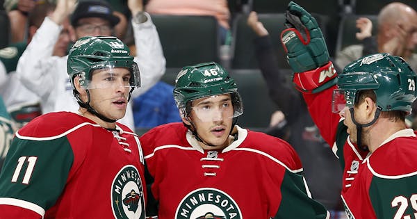 Jared Spurgeon (46) celebrated a goal in the first period with teammates Zach Parise (11) and Jason Pominville (29). ] CARLOS GONZALEZ &#xef; cgonzale
