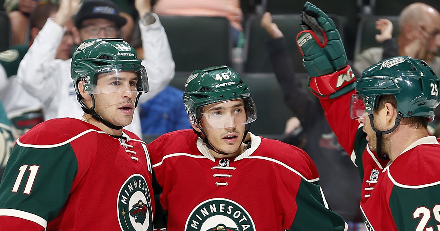 Jared Spurgeon (46) celebrated a goal in the first period with teammates Zach Parise (11) and Jason Pominville (29). ] CARLOS GONZALEZ &#xef; cgonzalez@startribune.com - September 21, 2015, St. Paul, MN, Xcel Energy Center, NHL, Minnesota Wild vs. Buffalo Sabres