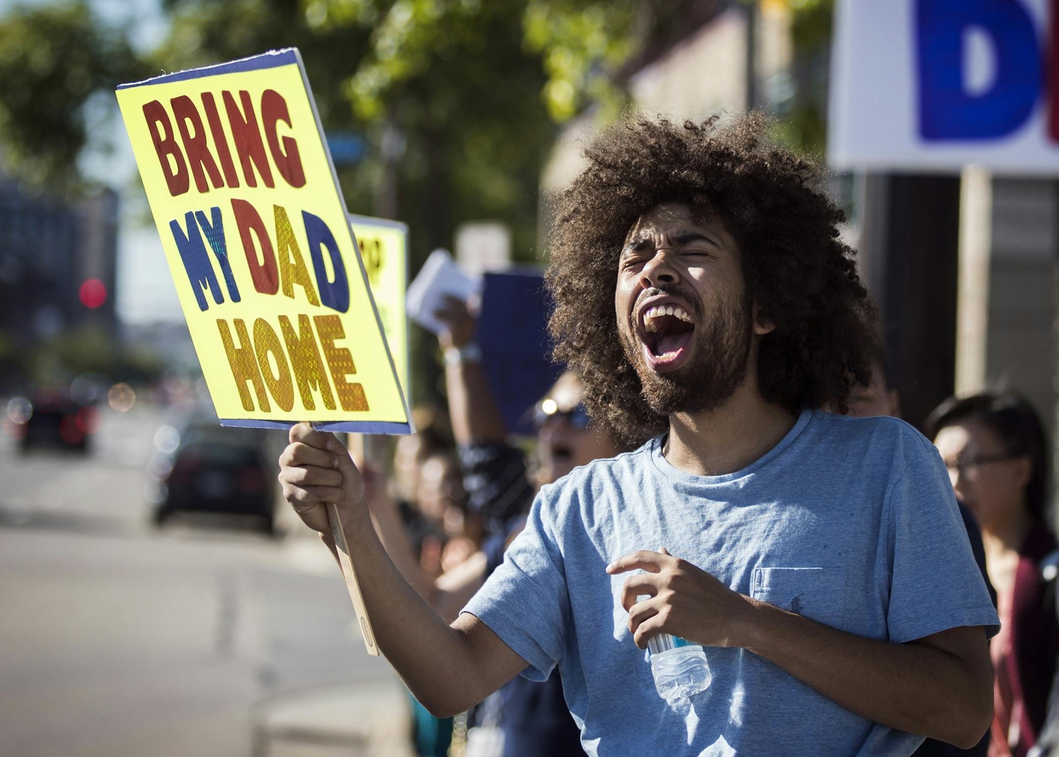 Marquel Hunt chants for his father Phoeuy Chung, who was detained by ICE in late August.