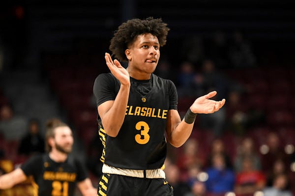 Nasir Whitlock (3) of DeLaSalle reacts after taking a 12 point lead late in the first half against Stewartville Tuesday, March 21, 2023 during a Class