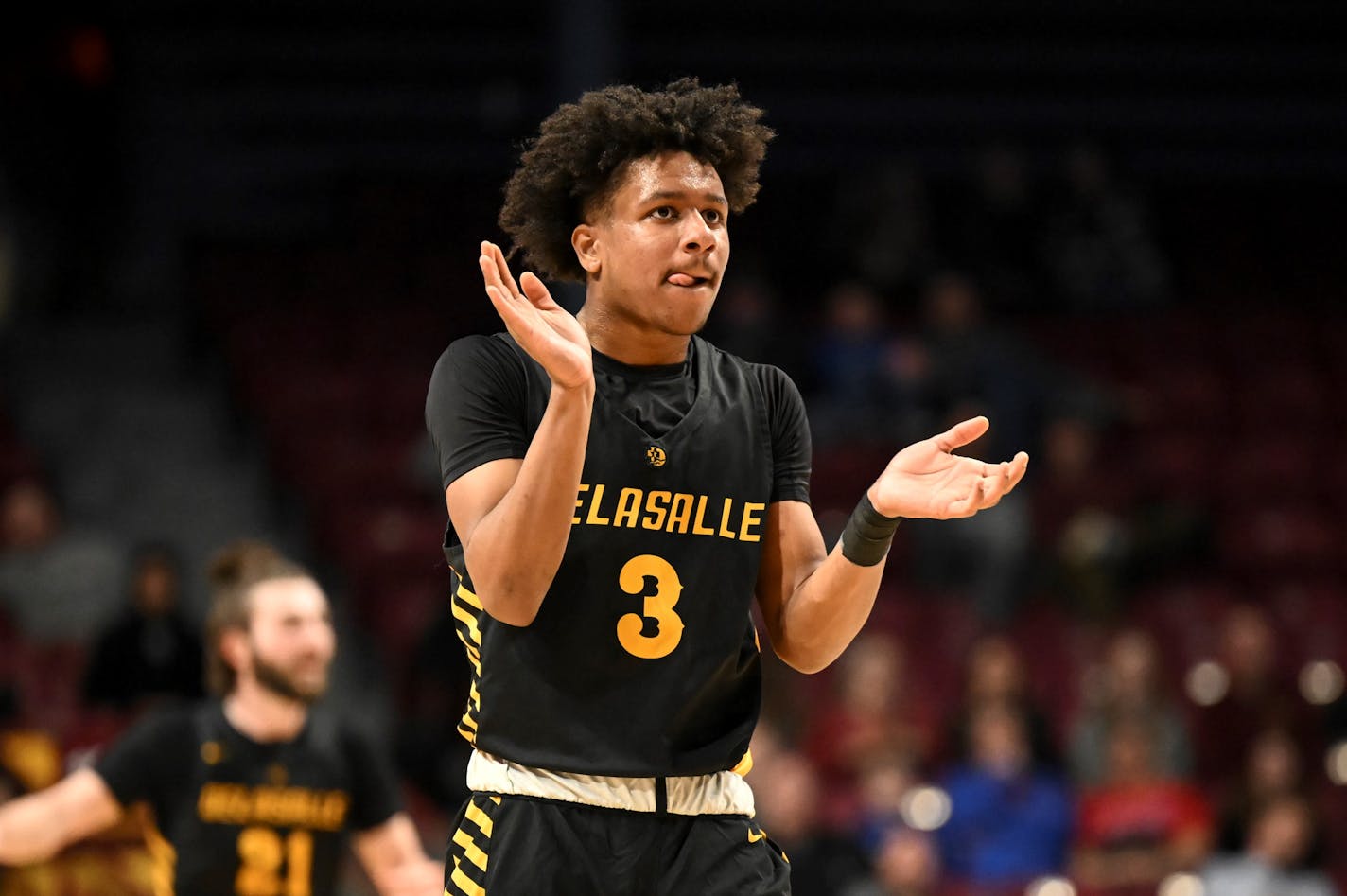 Nasir Whitlock (3) of DeLaSalle reacts after taking a 12 point lead late in the first half against Stewartville Tuesday, March 21, 2023 during a Class 3A boys' basketball state tournament quarterfinal game at Williams Arena in Minneapolis, Minn.. ] AARON LAVINSKY • aaron.lavinsky@startribune.com