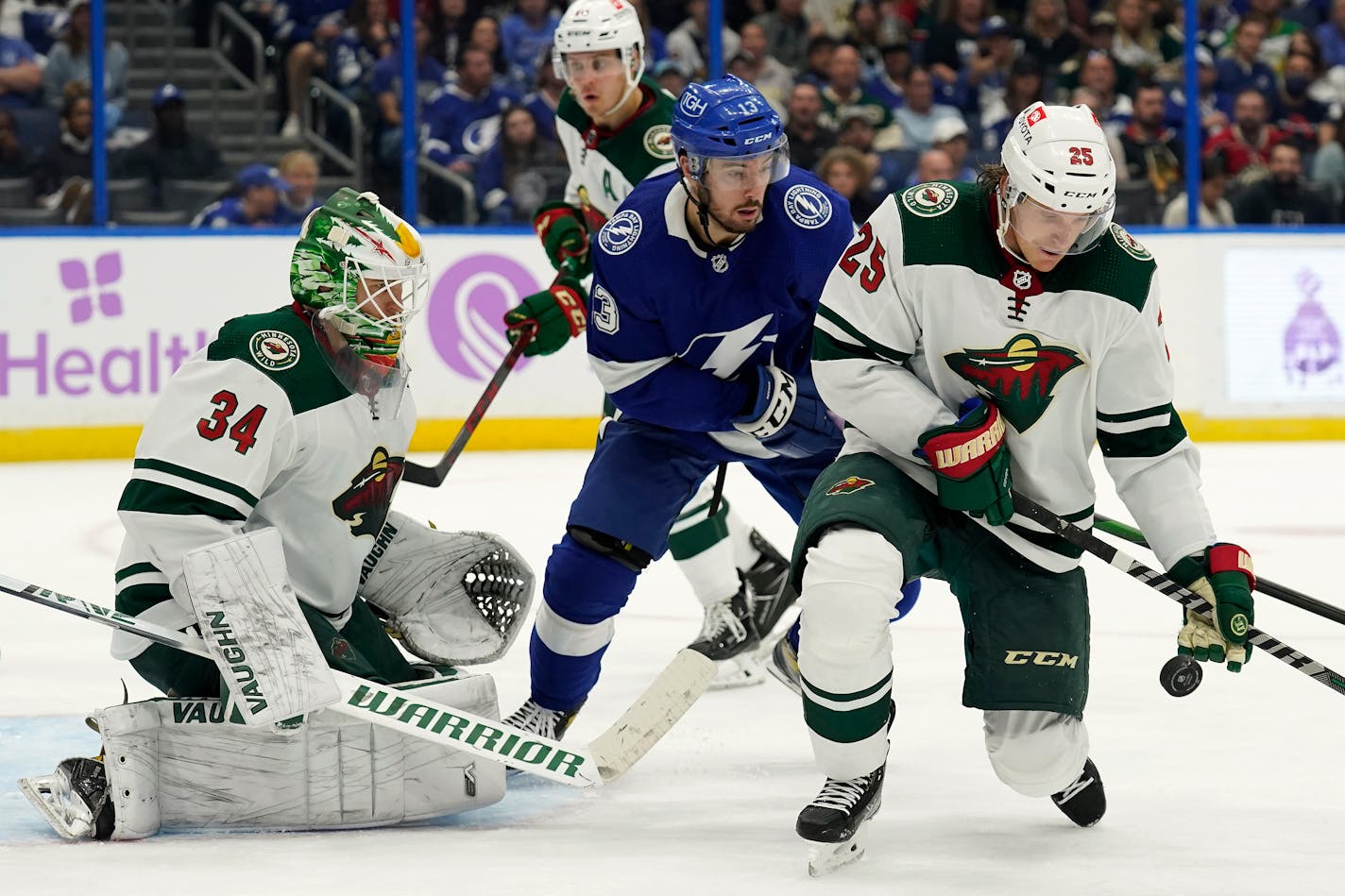 Wild defenseman Jonas Brodin blocks a shot in front of goaltender Kaapo Kahkonen and Tampa Bay Lightning left wing Boris Katchouk during the second period