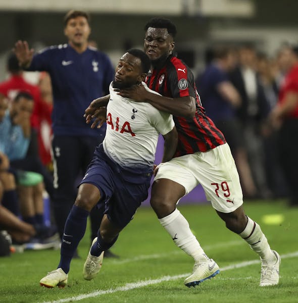 AC Milan midfielder Franck Kessie (79) earned a yellow card in the second half for his hand to the neck of Georges-Kevin Nkoudou (14). ] JEFF WHEELER 