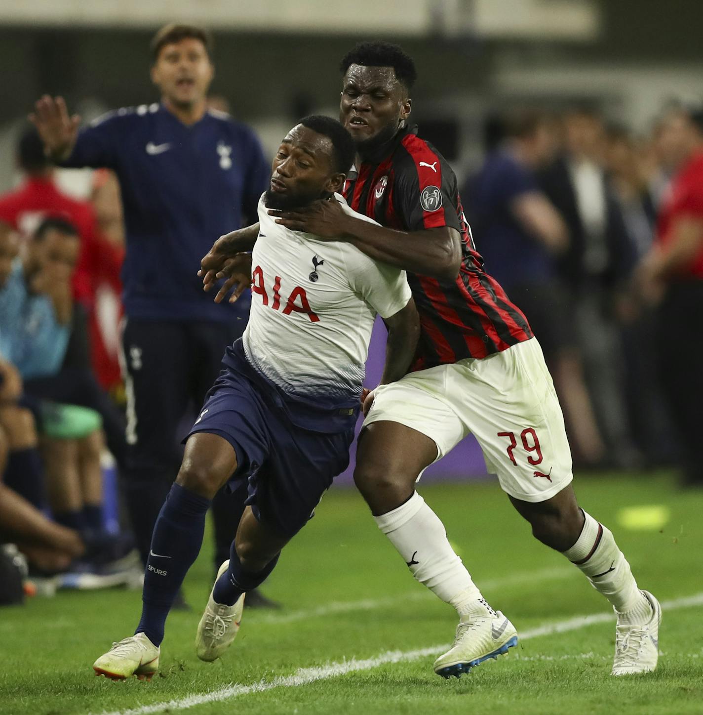 AC Milan midfielder Franck Kessie (79) earned a yellow card in the second half for his hand to the neck of Georges-Kevin Nkoudou (14). ] JEFF WHEELER &#xef; jeff.wheeler@startribune.com Tottenham Hotspur defeated AC Milan 1-0 in an International Champions Cup series game at U.S. Bank Stadium in Minneapolis Tuesday night, July 31, 2018.