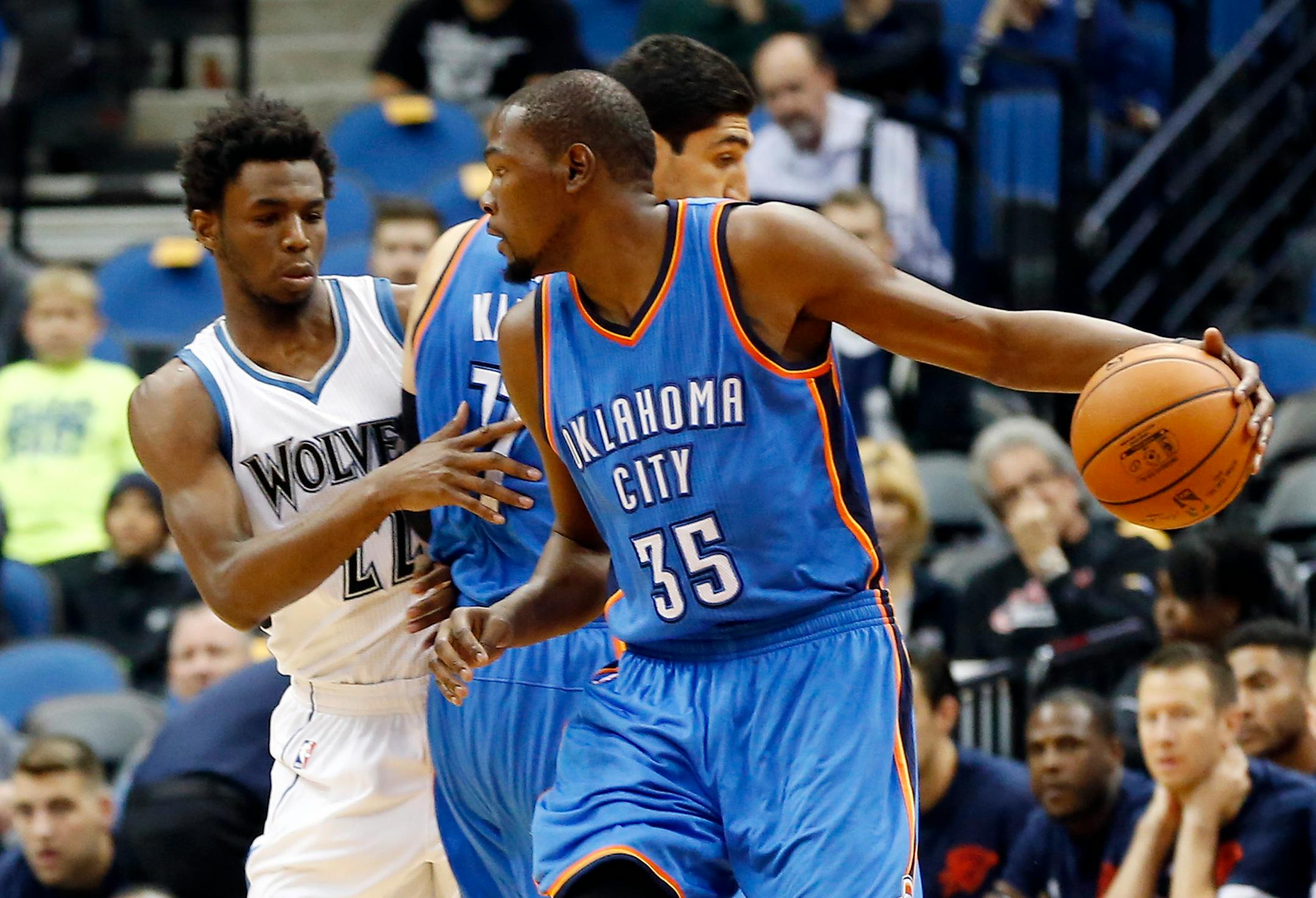 Oklahoma City Thunder's Kevin Durant, right, drives as Enes Kanter sets a pick on Minnesota Timberwolves' Andrew Wiggins.