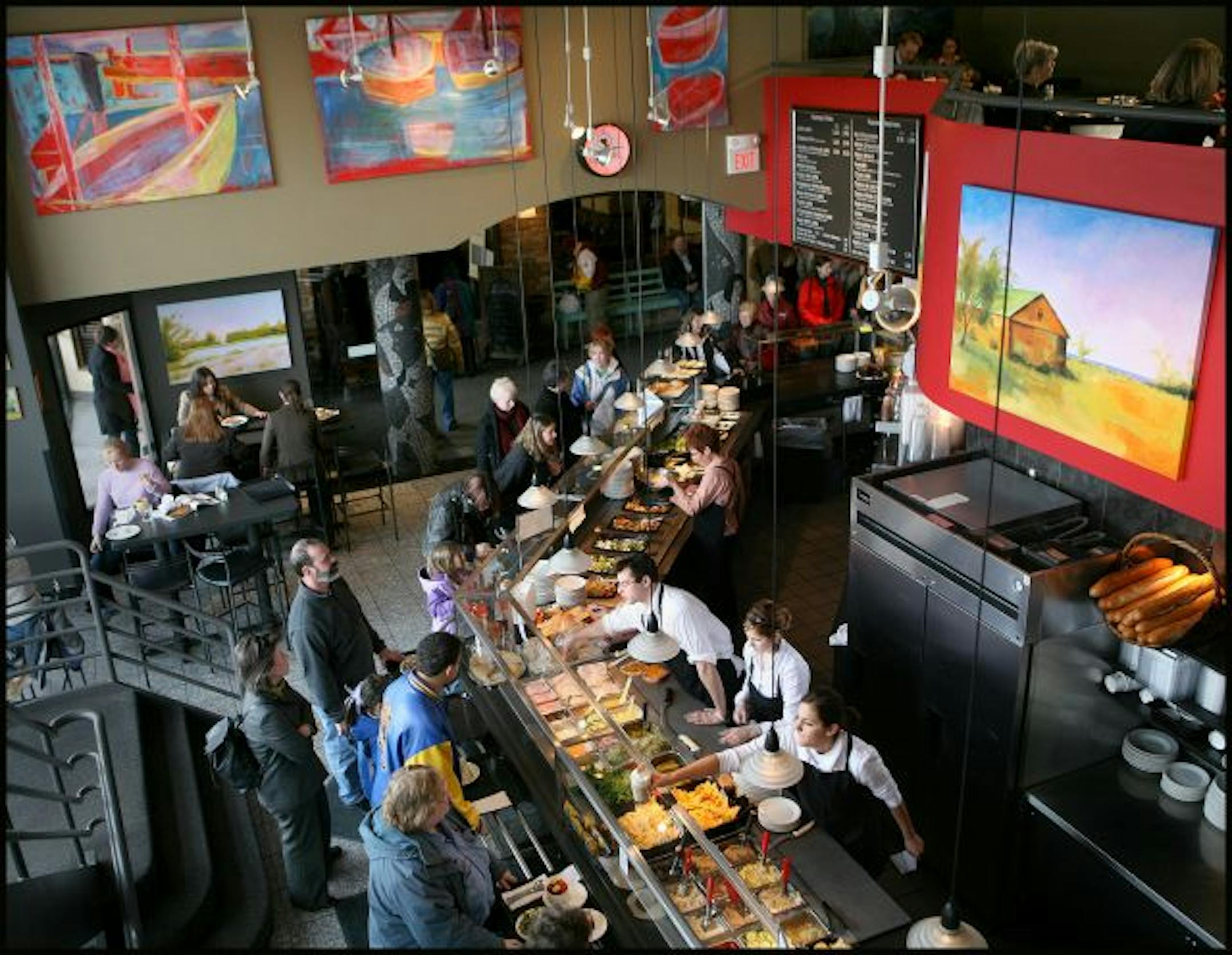 TOM WALLACE �twallace@startribune.com #109049.rn0222 02/16/2007 restaurant review of Cafe Latte. CAPTION: Owners Peter and Linda Quinn owners of Cafe Latte. The food line during Friday's Lunch Hour at Cafe Latte in St Paul.