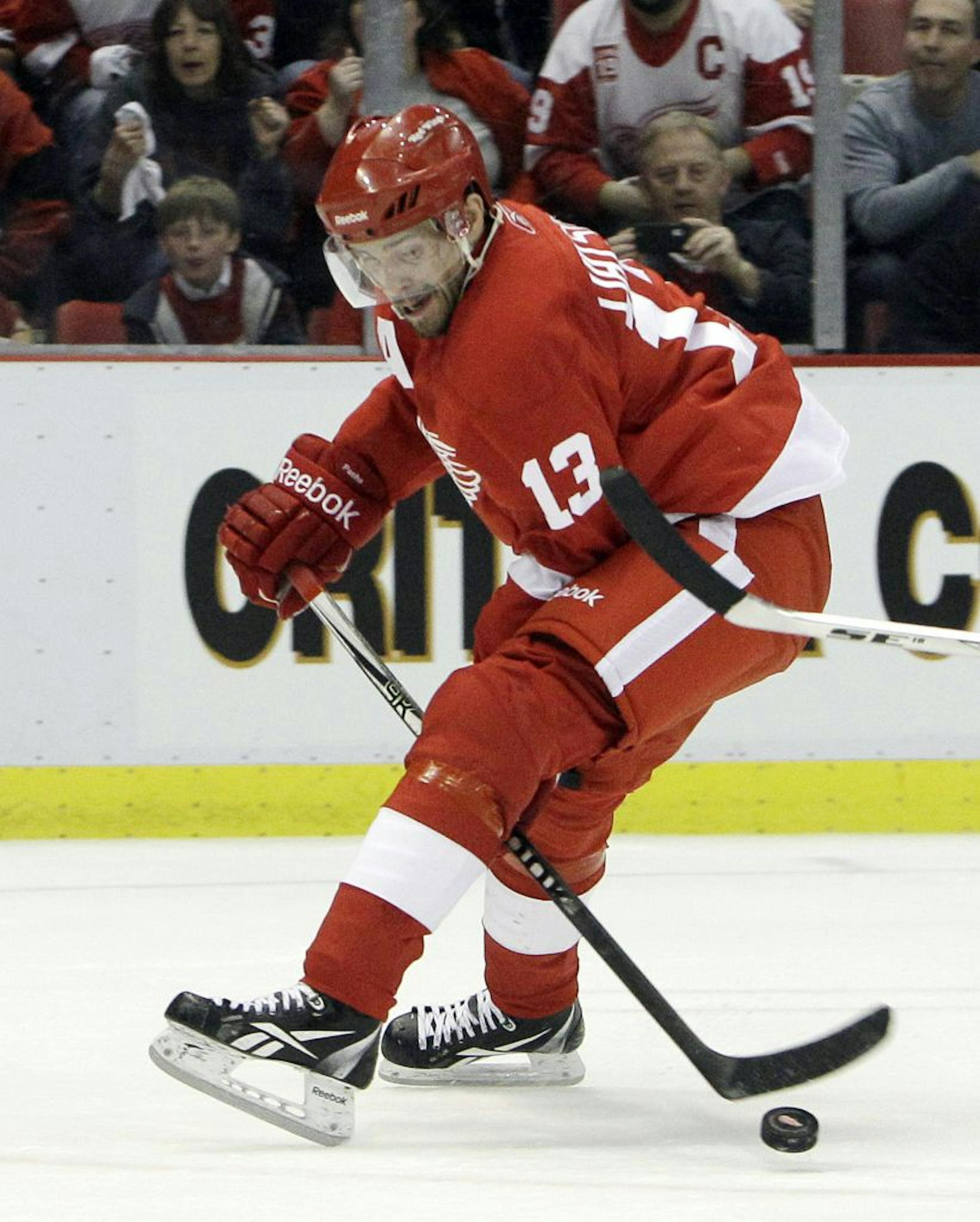 Detroit Red Wings center Pavel Datsyuk (13) of Russia controls the puck during the first period in Game 2 of a first-round NHL Stanley Cup playoffs hockey series against the Phoenix Coyotes in Detroit, Saturday, April 16, 2011.