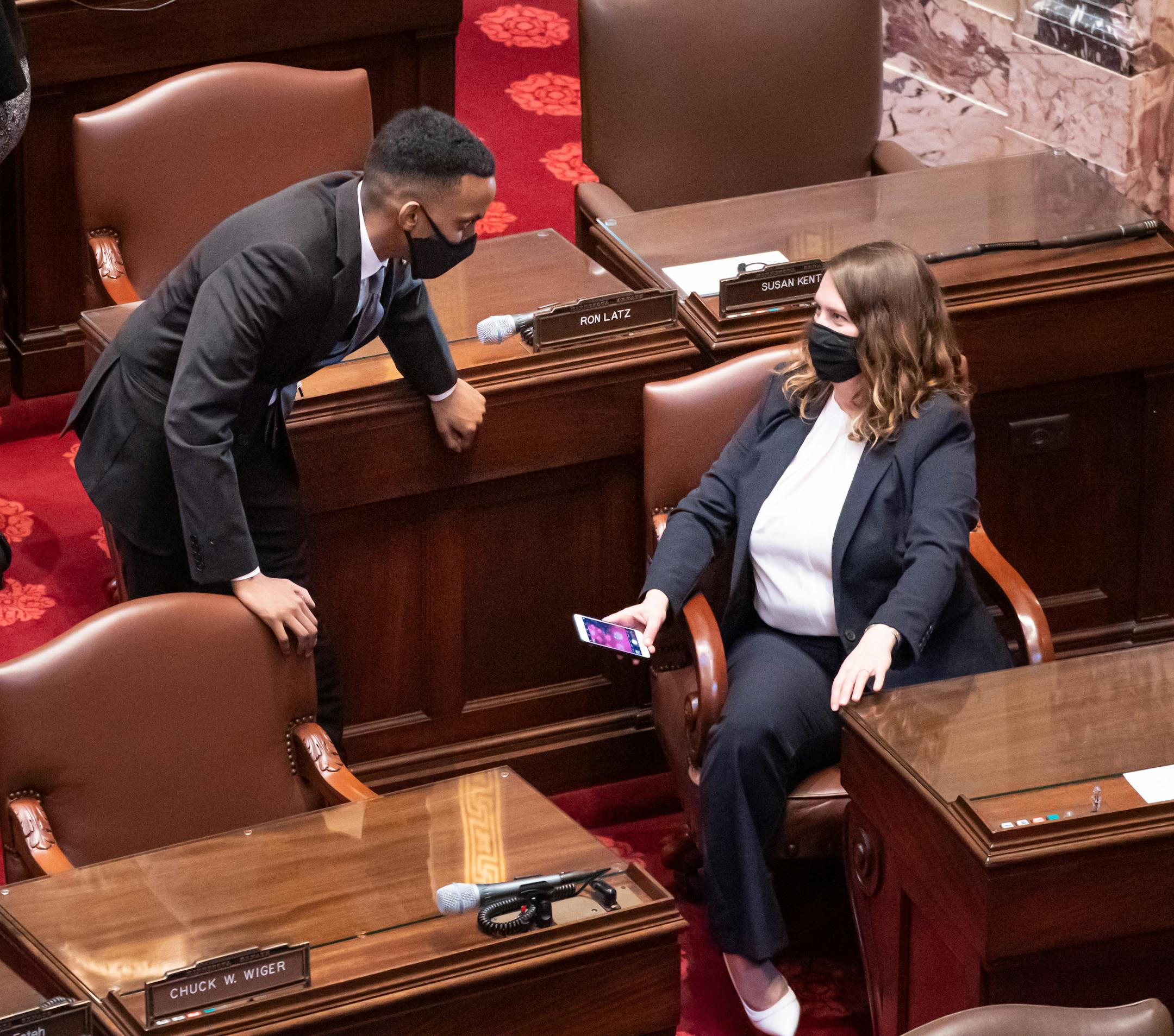 Freshman Senators Sen. Omar Fateh, DFL-Minneapolis and Sen. Jennifer McEwen, DFL-Duluth, talked on the Senate floor duirng a vote.  Most Senators were sworn in remotely at the Minnesota State Capitol. Later there was a leadership floor fight about continuing the term of President-ProTem of Sen. David Tomassoni, DFL-Chisholm.