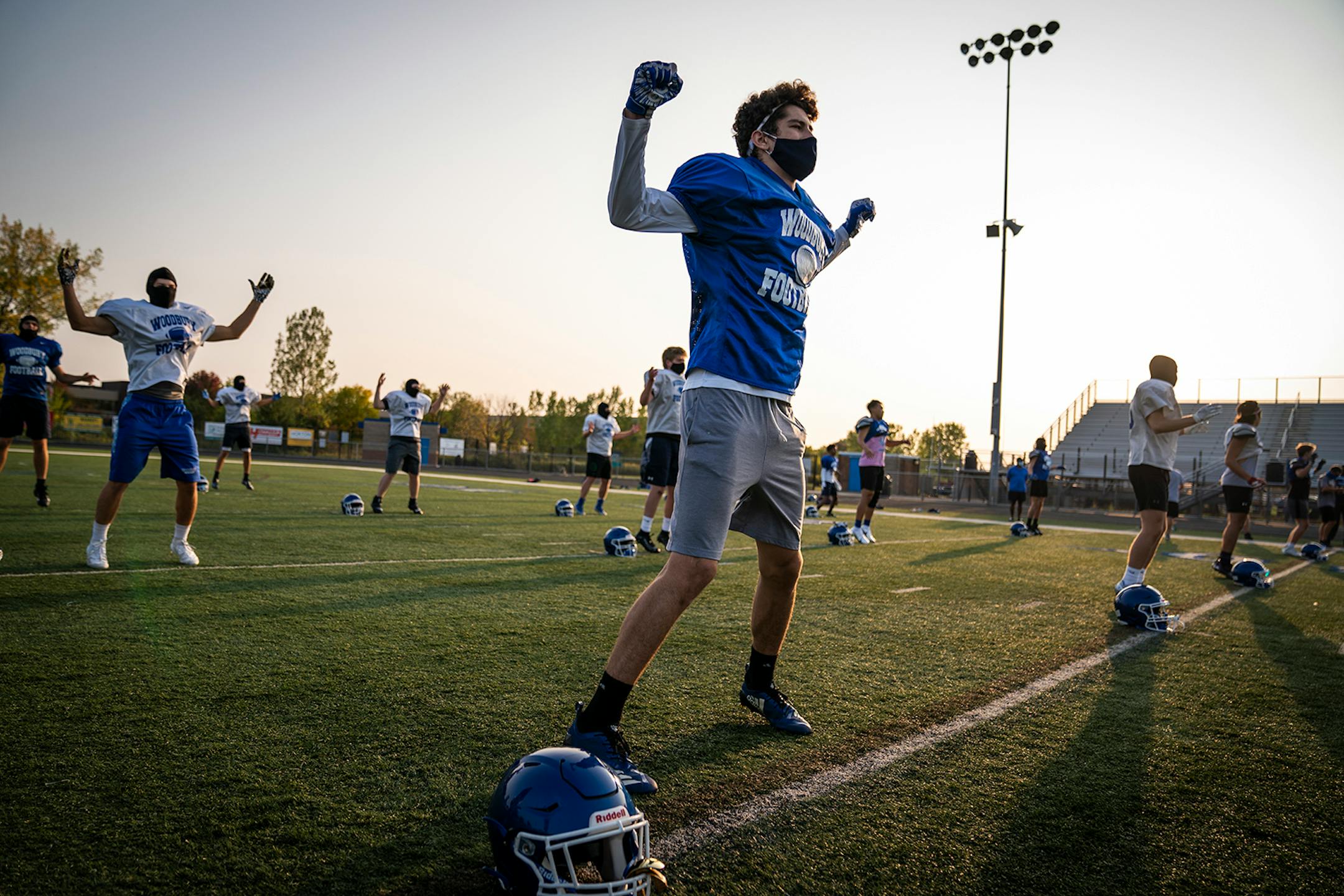 Defensive back James Maier warmed up during Woodbury High School football practice.on Monday.
