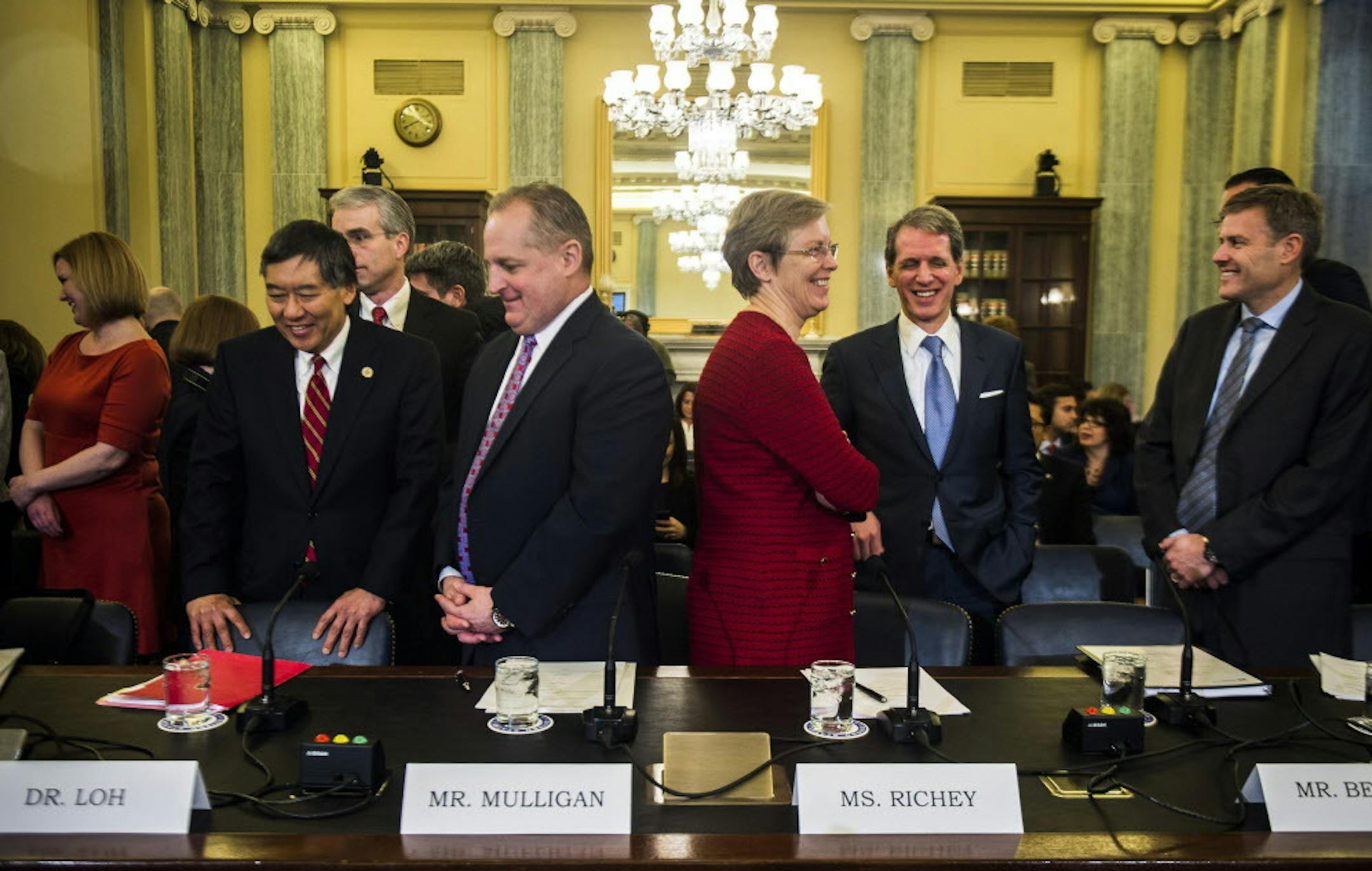 Target Corporation Vice President and chief financial officer John Mulligan, second from left, attends a U.S. Senate Committee on Commerce, Science and Transportation hearing on protecting personal consumer information from cyber attacks and data breaches on Capitol Hill in Washington, March 26, 2014. From left: University of Maryland President Wallace Loh, Mulligan, Visa Chief Enterprise Risk Officer Ellen Richey, Marsh & McLennan Executive Vice President and General Counsel Peter Beshar, and E
