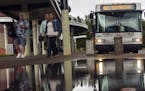 At the Burnsville Transit Station, commuters got off the bust during rush hour.] Richard Tsong-Taatarii/rtsong-taatarii@startribune.com