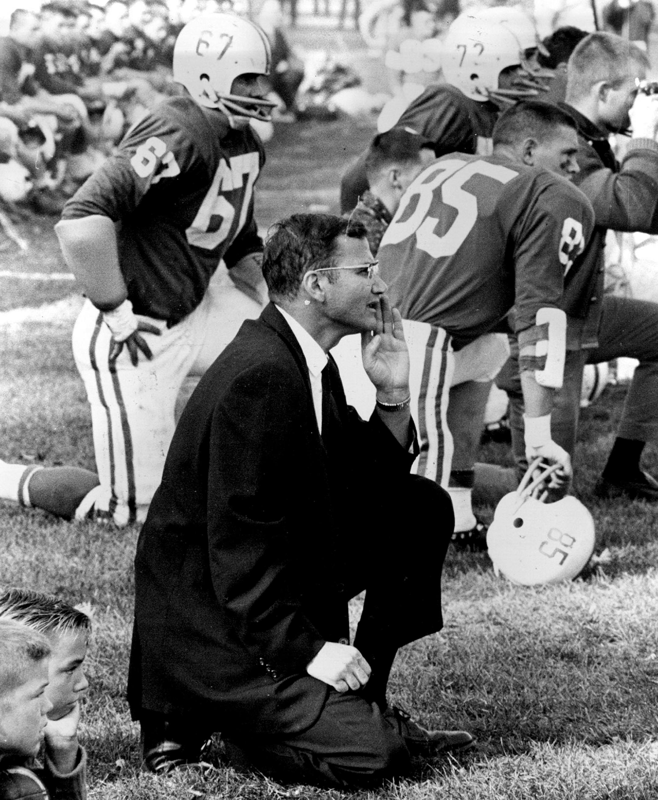St. John's football coach John Gagliardi kneeled on the sidelines during an October 1963 game.