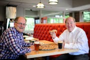 Bob Stupka, left, Davanni&#x2019;s president and CFO, and Mick Stenson, founder and CEO, each had a beer with their pizza at Davanni&#x2019;s in Edina