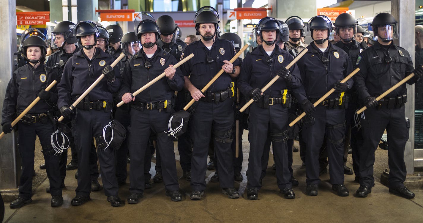 Police turned Black Lives Matter protesters back who had made their way from the Mall of America to Terminal 2 of MSP.] Richard Tsong-Taatarii/rtsong-taatarii@startribune.com