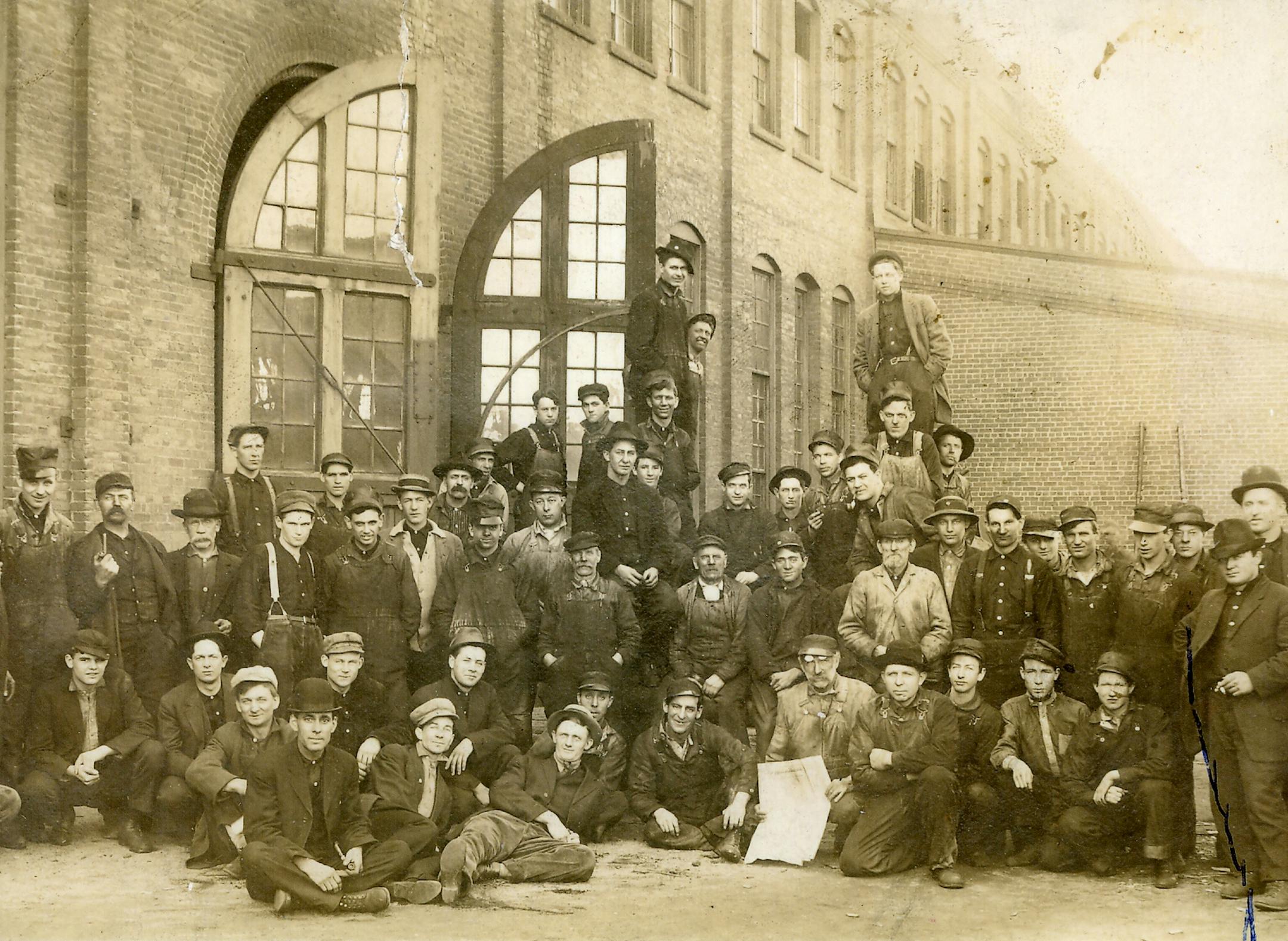 A group of boilermakers posed outside of plant doors about 1905 to 1909.